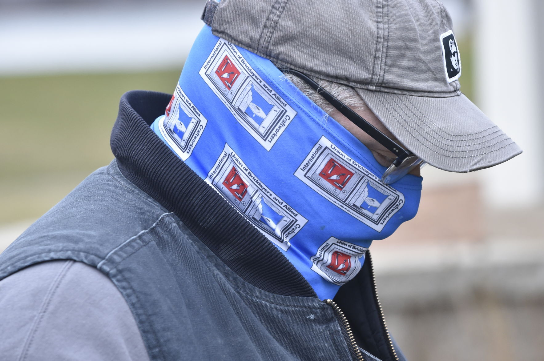Man wears International Union of Bricklayers and Allied Craftworkers mask to Black Education Matters Demonstration